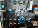 a wall with many different types of hoses on it