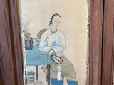 painting of a man sitting at a table with a hat on his head