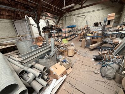 a large room full of metal pipes and other items