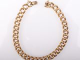 an image of a gold chain bracelet on a white background