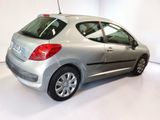 a silver car that is parked in a white room