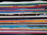 a lot of children ' s books stacked on top of each other