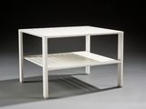 an image of a white side table with a shelf underneath it