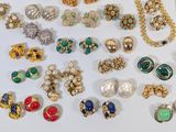 a close up of a bunch of jewelry on a white surface