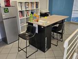 an image of a kitchen with a table and chairs