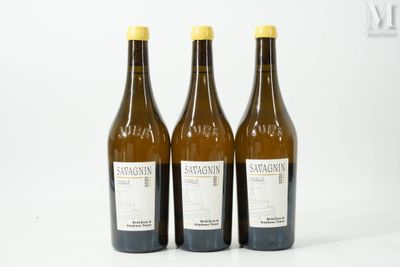 three bottles of wine sitting next to each other on a table