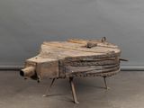 a small wooden object that is sitting on a table