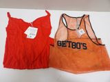 an orange and red tank top and a red mesh vest