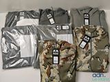 many different shirts that are on display on a table