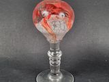 a glass wine glass with a picture of a woman on it