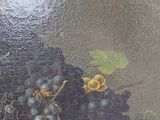 a painting of grapes and birds in a basket on a table