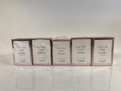 four boxes of soap sitting on top of a white table