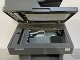 the printer is sitting on top of the box with the lid open