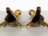 pair of antique brass figurines of a man and a woman