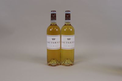 two bottles of wine sitting next to each other on a table