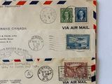 several old envelopes with stamps on them sitting on top of a table