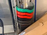 boxes and umbrellas are stacked on top of each other in a room