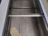a picture of a conveyor belt with a piece of cardboard on it