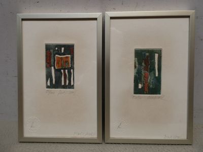 two framed pictures of a couple of people on the wall