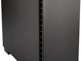 a black computer case sitting on top of a white surface