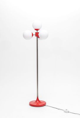 an image of a red and white floor lamp with a red base