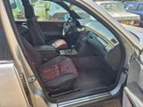 the interior of a car with the door open and the seat up