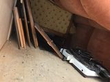 a brown couch and a brown chair in the corner of a room