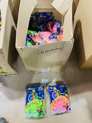 three boxes of candy sitting on the floor next to each other