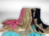 three different colors of shaws with gold lace on them