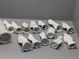 a pile of toilet paper on the floor next to a roll of toilet paper