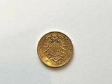 an image of a gold coin on a white surface