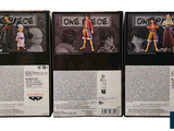 three boxes of one piece action figures on a white background