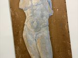 painting of a female torso on a cardboard board on a wall