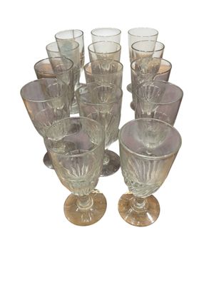 a lot of glasses that are sitting on a table