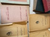 a lot of books that are sitting on a table