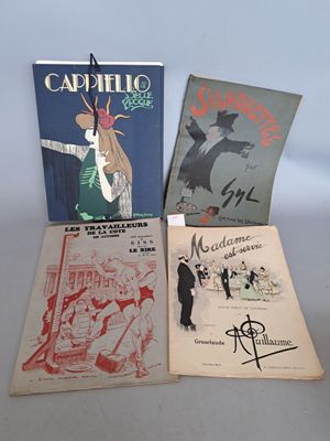 trois livres sont posés sur une table les uns à côté des autres