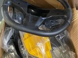 a cardboard box with a steering and some other items in it