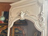 a large mirror in the corner of a room