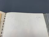 someone is writing on a piece of paper with a pen