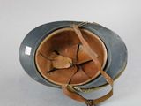 an image of a helmet with a leather strap on top of it