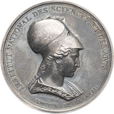 une image représentant une médaille d'argent sur laquelle figure la tête d'une femme