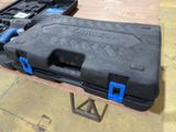 a black case with a blue handle on a table