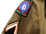 a close up of a jacket with patches on it