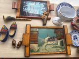 a picture of a wall with a picture of a house and a painting on it