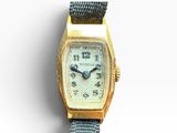 an image of a gold wrist watch on a white background