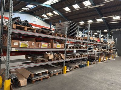 shelves in a warehouse filled with lots of boxes and boxes