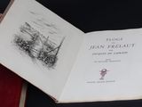 a person holding an open book with a drawing on it