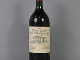 a bottle of wine that is sitting on a table