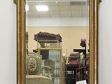 a mirror that is sitting on the floor in a room