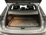 the back of a car with the trunk open and the back seats down